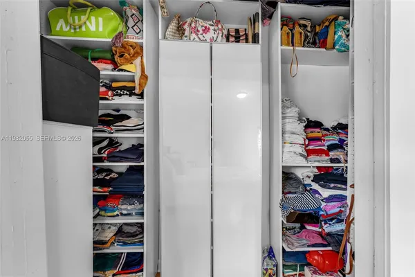 a view of a closet with storage