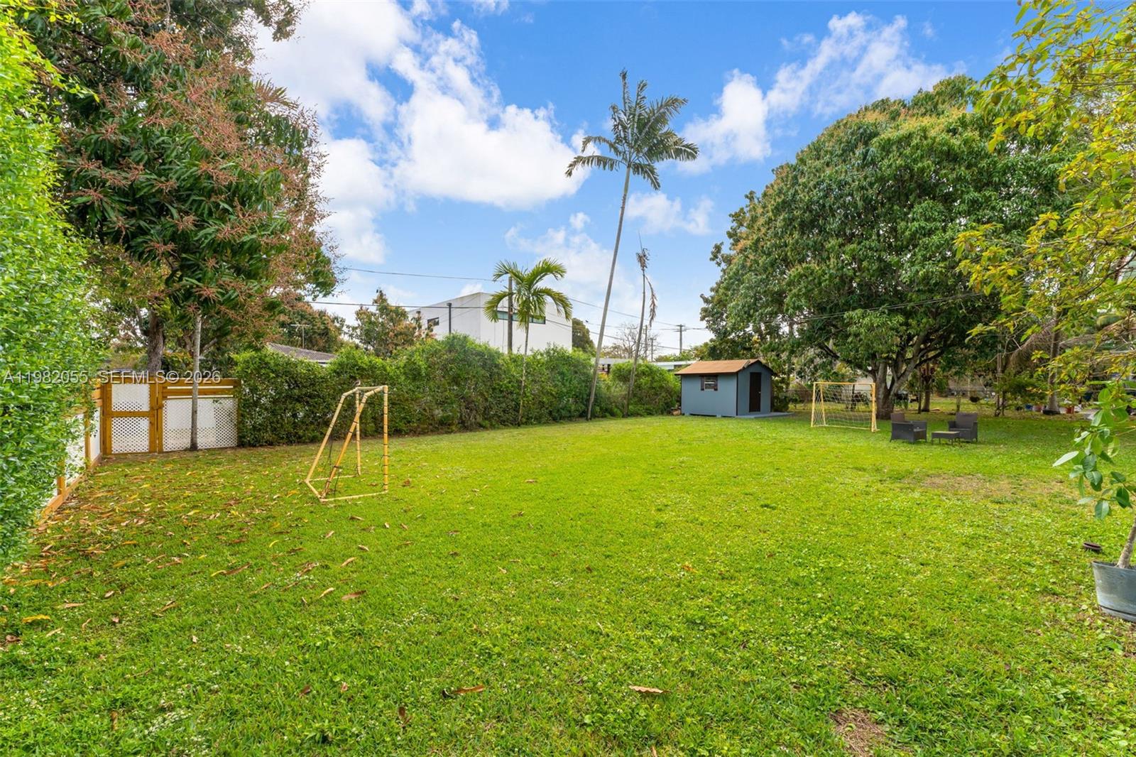 149 Fern Way Miami Springs, FL 33166 - Photo 25 of 35 a view of a garden with a slide