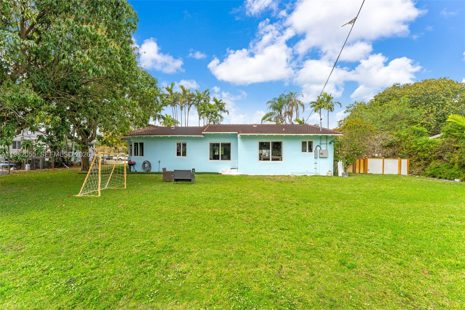 149 Fern Way Miami Springs, FL 33166 - Photo 27 of 35 a view of a house with a backyard