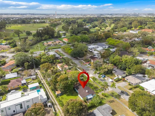 an aerial view of residential houses with outdoor space