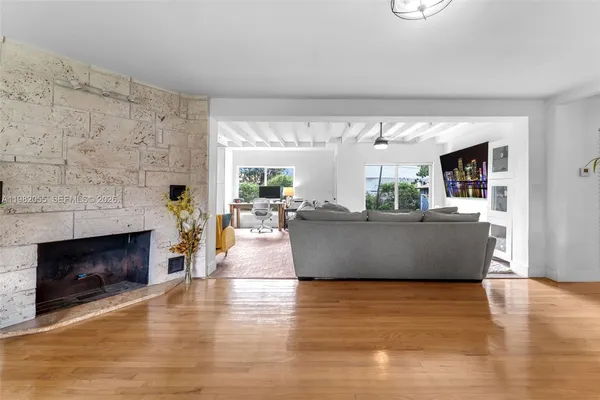 a living room with furniture and a fireplace