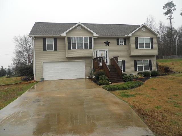 260 Dixon Road Demorest, GA 30535 - Photo 1 of 1 a front view of a house with a yard and garage