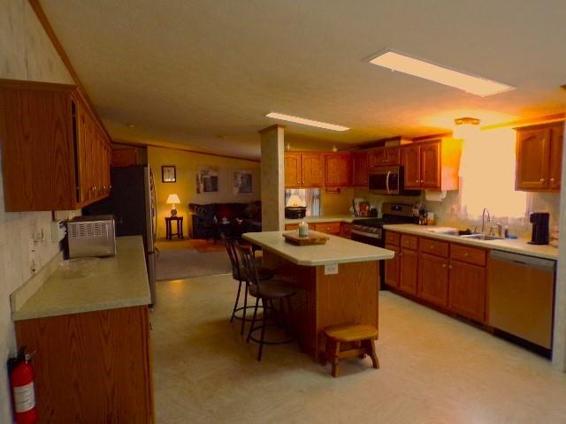 629 Deana Way Rochester, PA 15074 - Photo 8 of 23 a kitchen with a sink refrigerator and cabinets