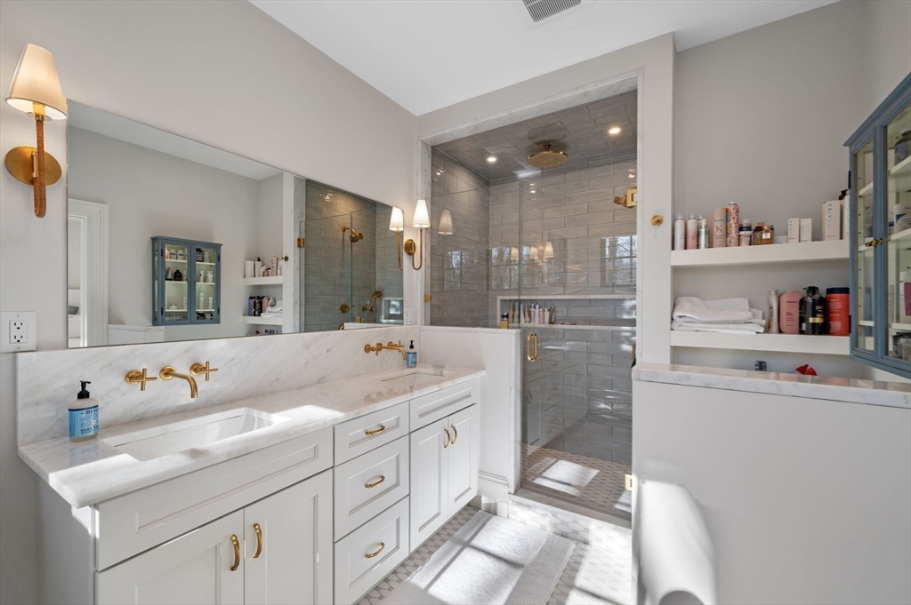 16 Liberty Road Marblehead, MA 01945 - Photo 16 of 29 a bathroom with a tub sink and mirror
