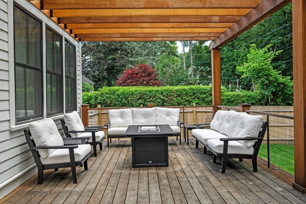 16 Liberty Road Marblehead, MA 01945 - Photo 24 of 29 a view of patio with table and chairs and wooden floor