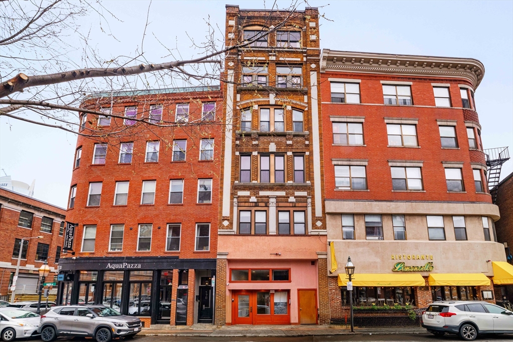 188 North Street, Unit 42 Boston, MA 02113 - Photo 17 of 19 a front view of a building with lot of cars and trees