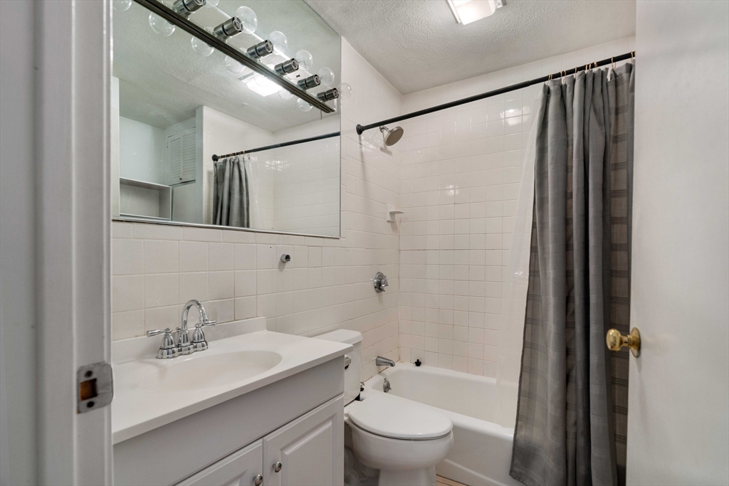 188 North Street, Unit 42 Boston, MA 02113 - Photo 3 of 19 a bathroom with a sink a toilet and shower