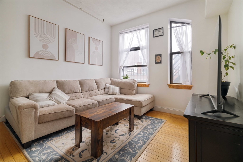 188 North Street, Unit 42 Boston, MA 02113 - Photo 6 of 19 a living room with furniture and a window