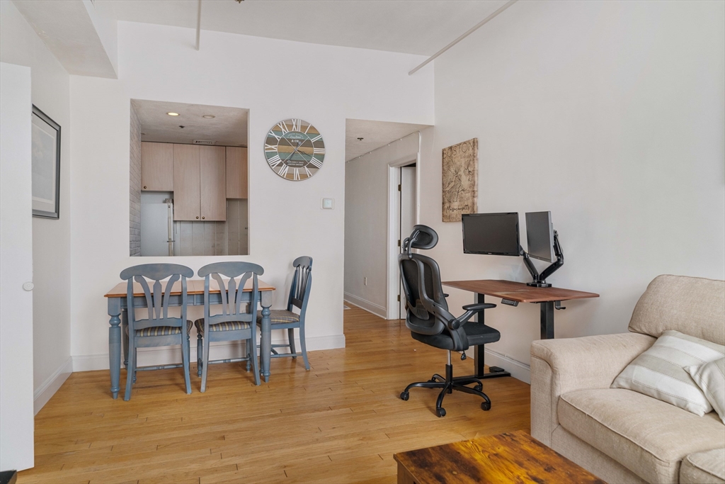 188 North Street, Unit 42 Boston, MA 02113 - Photo 9 of 19 a view of a livingroom with workspace and a couch