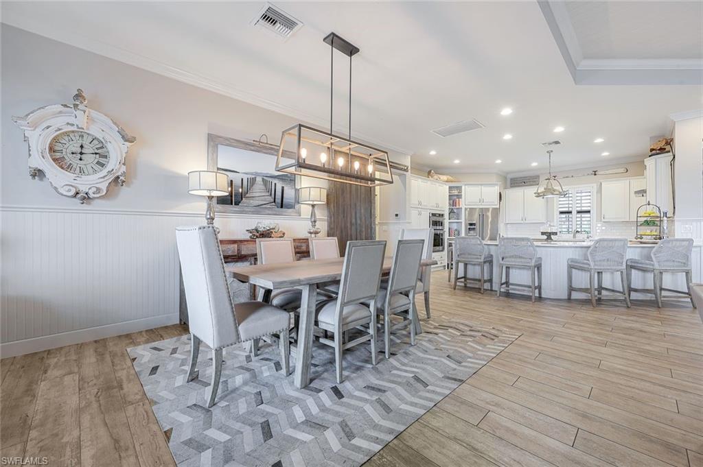 9206 Marble Stone Drive Naples, FL 34120 - Photo 21 of 50 a view of a dining room with furniture