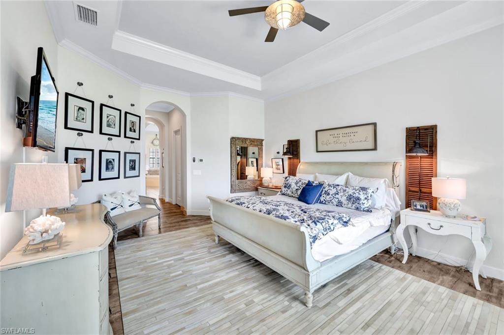 9206 Marble Stone Drive Naples, FL 34120 - Photo 23 of 50 a living room with furniture and a chandelier