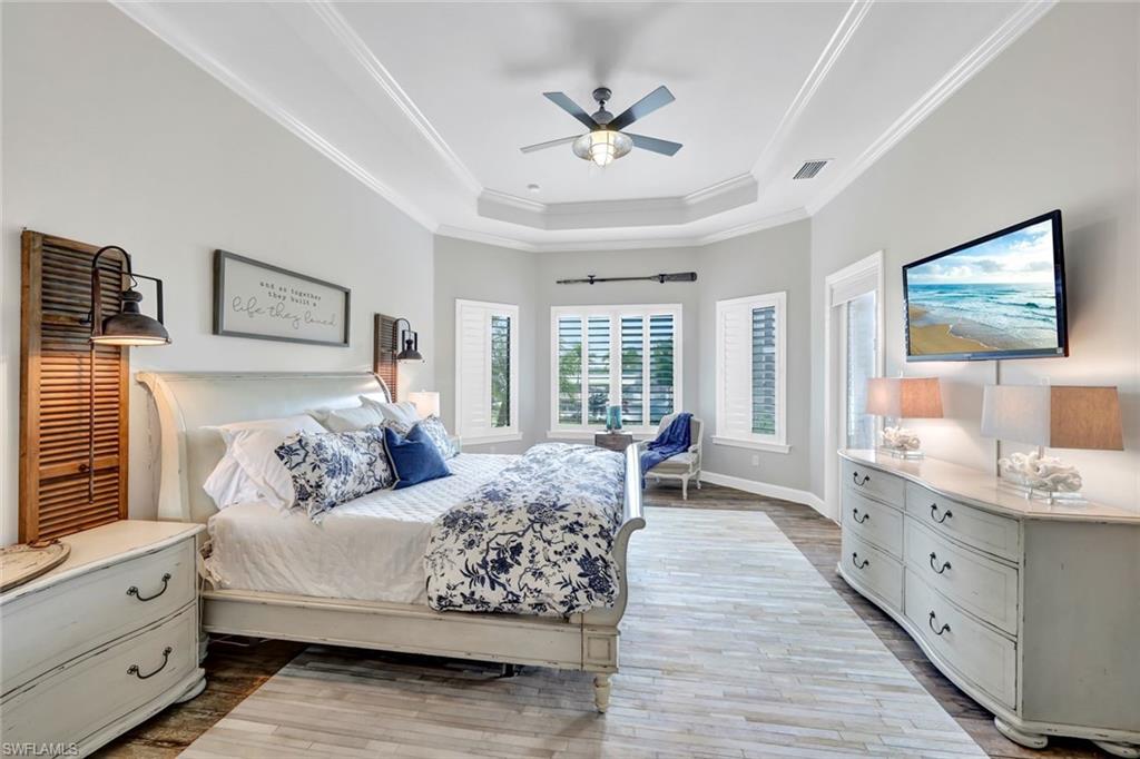 9206 Marble Stone Drive Naples, FL 34120 - Photo 24 of 50 a spacious bedroom with a large bed and a window