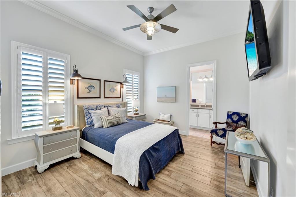 9206 Marble Stone Drive Naples, FL 34120 - Photo 27 of 50 a living room with a bed furniture and a window