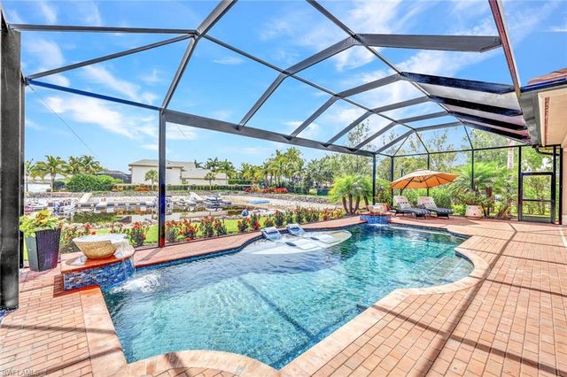a view of a swimming pool with a porch