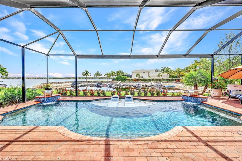9206 Marble Stone Drive Naples, FL 34120 - Photo 40 of 50 a view of a swimming pool and outdoor space