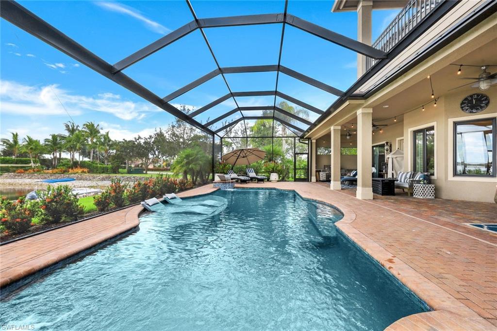 9206 Marble Stone Drive Naples, FL 34120 - Photo 4 of 50 a view of swimming pool with a outdoor seating