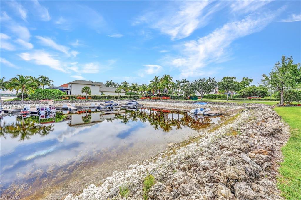 9206 Marble Stone Drive Naples, FL 34120 - Photo 45 of 50 a view of a lake with a beach
