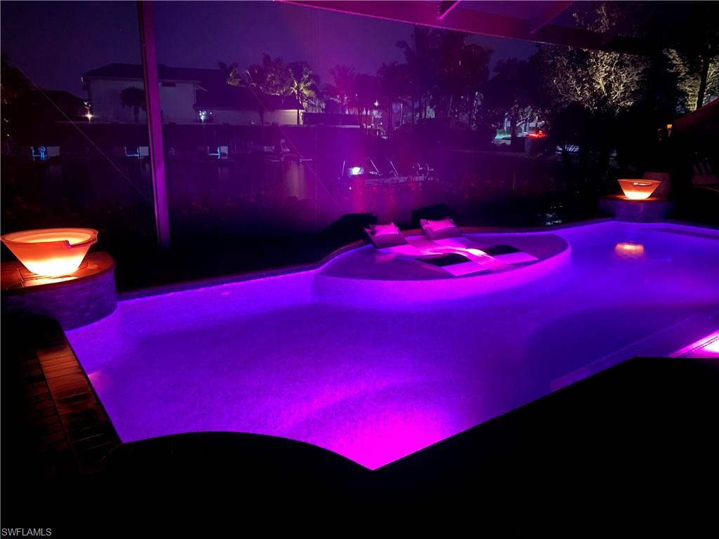 9206 Marble Stone Drive Naples, FL 34120 - Photo 5 of 50 a view of a red building with swimming pool