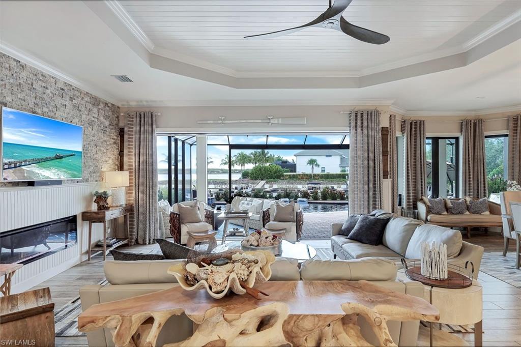 9206 Marble Stone Drive Naples, FL 34120 - Photo 10 of 50 a living room with furniture and a large window