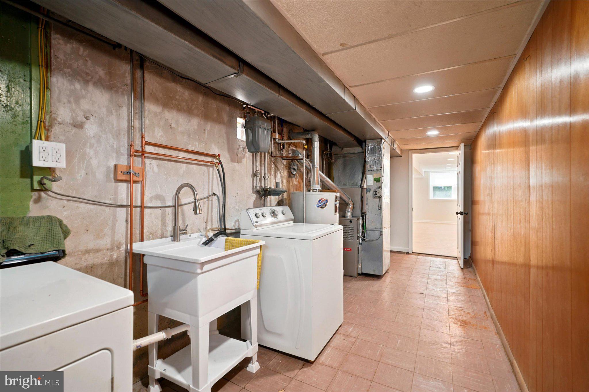 668 Renz Street Philadelphia, PA 19128 - Photo 24 of 25 Functional basement laundry space.