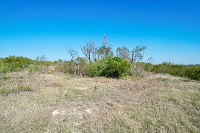 a view of a lake with houses in the back