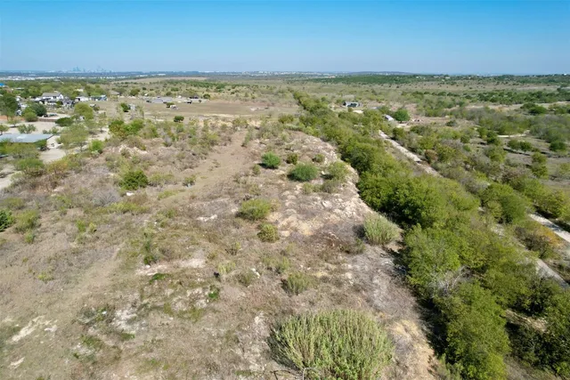 a view of a forest with a lake