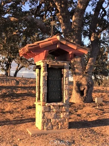 a view of a house with a tree