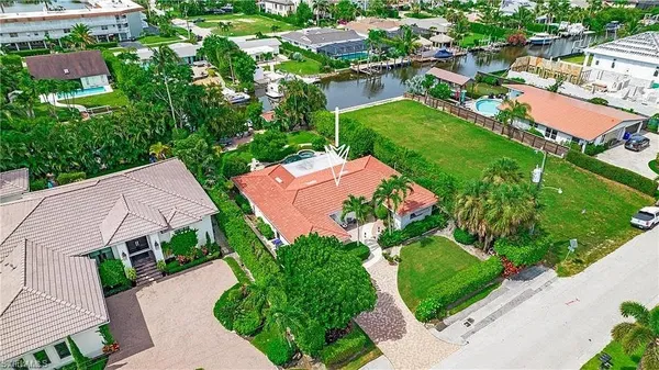 an aerial view of multiple houses with yard