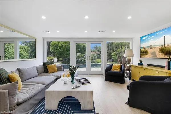 a living room with furniture and a large window