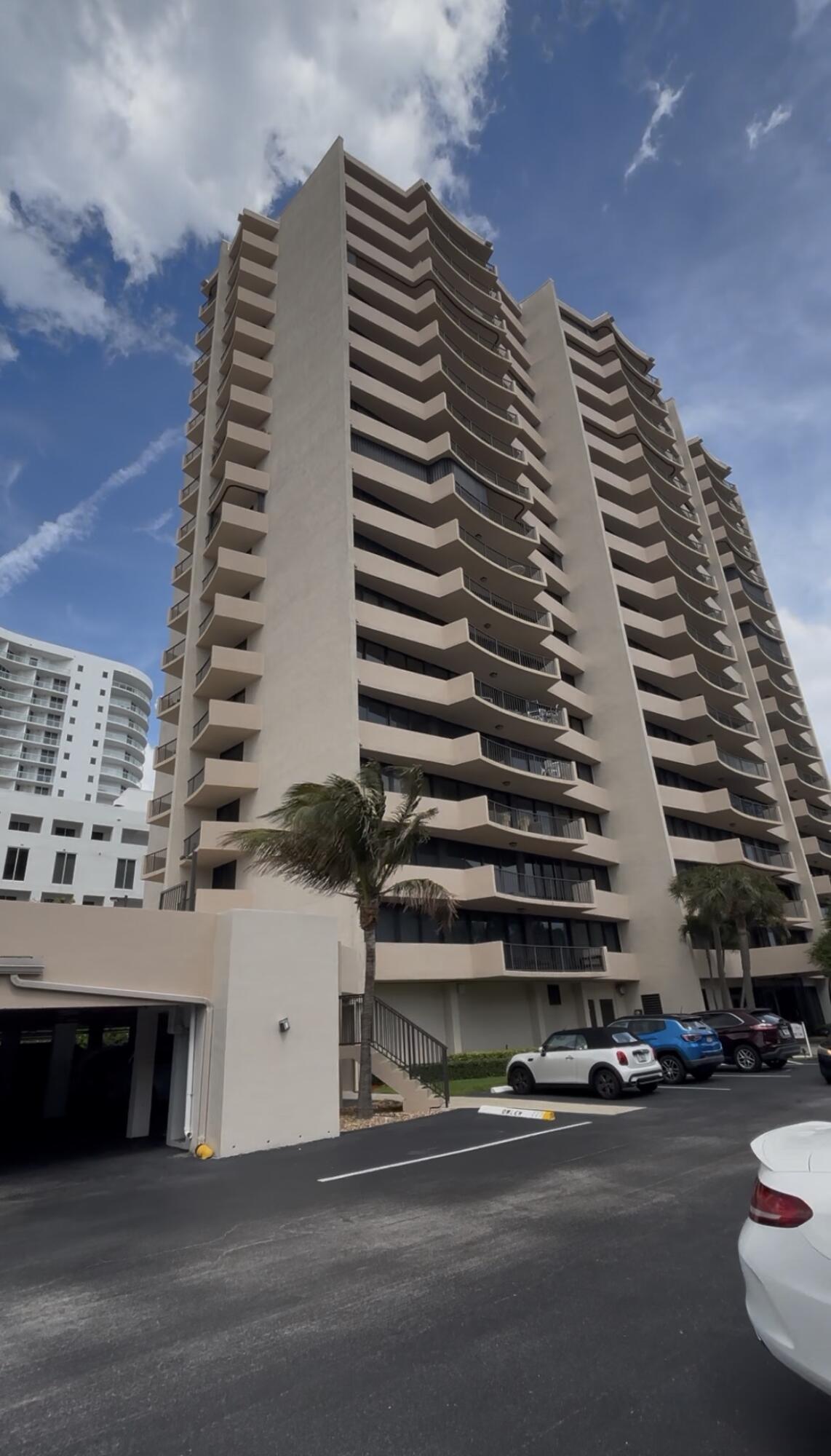 4200 North Ocean Avenue, Unit 1605 Riviera Beach, FL 33404 - Photo 1 of 19 a view of a large building next to a road