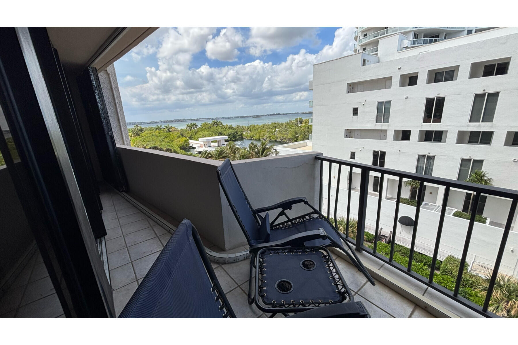 4200 North Ocean Avenue, Unit 1605 Riviera Beach, FL 33404 - Photo 16 of 19 a view of a balcony with wooden floor
