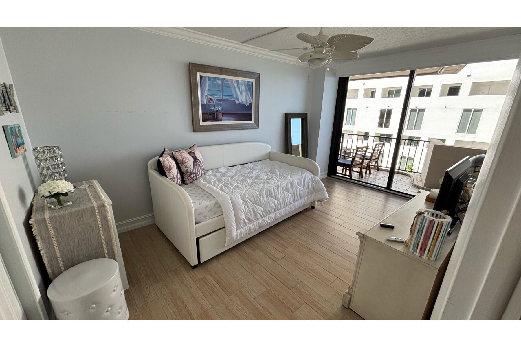 4200 North Ocean Avenue, Unit 1605 Riviera Beach, FL 33404 - Photo 4 of 19 a living room with furniture and a floor to ceiling window