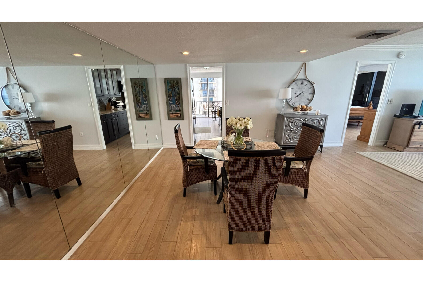 4200 North Ocean Avenue, Unit 1605 Riviera Beach, FL 33404 - Photo 5 of 19 a view of a dining room with furniture and wooden floor
