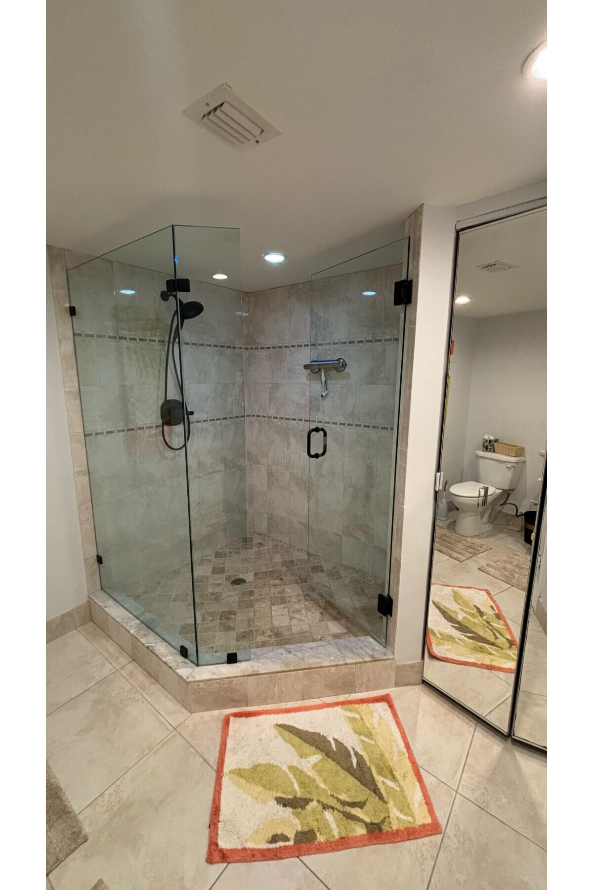 4200 North Ocean Avenue, Unit 1605 Riviera Beach, FL 33404 - Photo 9 of 19 a bathroom with a shower and a toilet