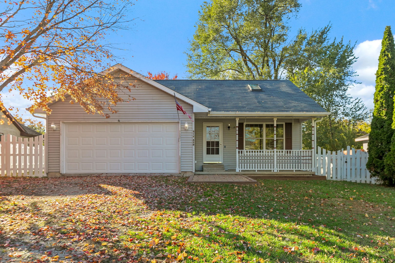 front view of a house with a yard
