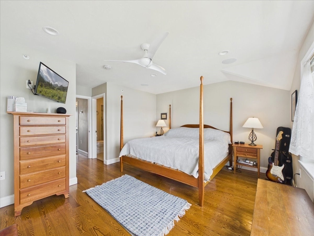 7 Bay Street, Unit 3 Hull, MA 02045 - Photo 25 of 40 a bed room with a bed and furniture
