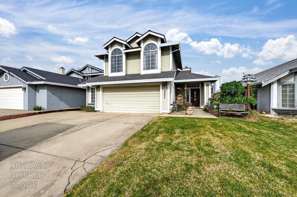 4625 Shade Tree Way Antelope, CA 95843 - Photo 1 of 1 a front view of a house with a yard and garage