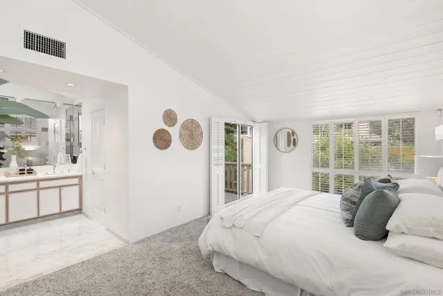 a bathroom with a sink vanity granite shower and a mirror