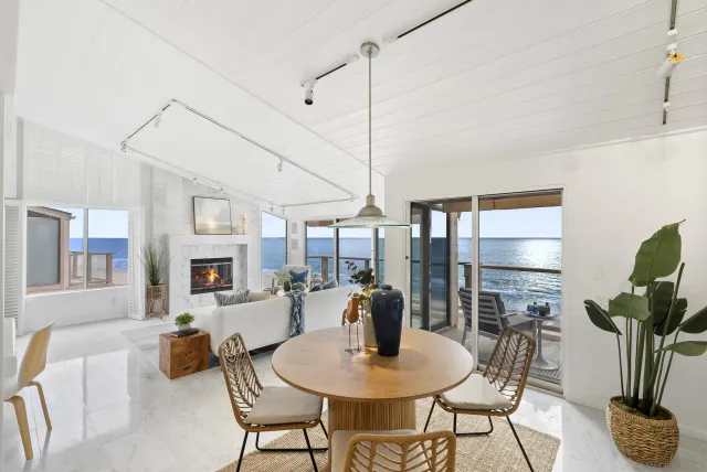 a dining room with furniture and wooden floor
