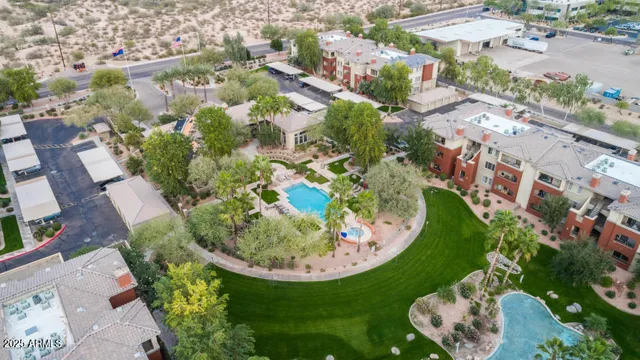 an aerial view of a house with a swimming pool
