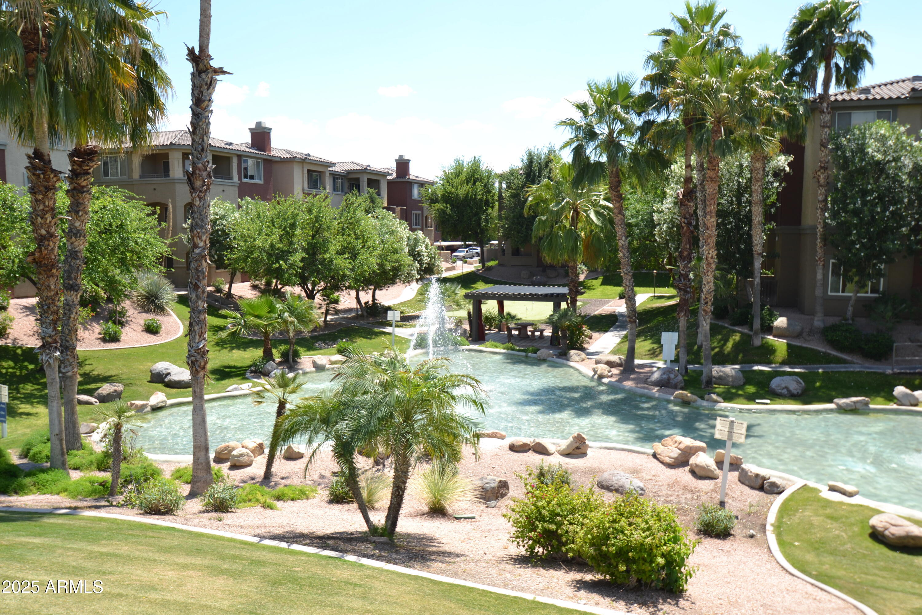 5401 East Van Buren Street, Unit 1011 Phoenix, AZ 85008 - Photo 17 of 17 a view of a swimming pool with a patio