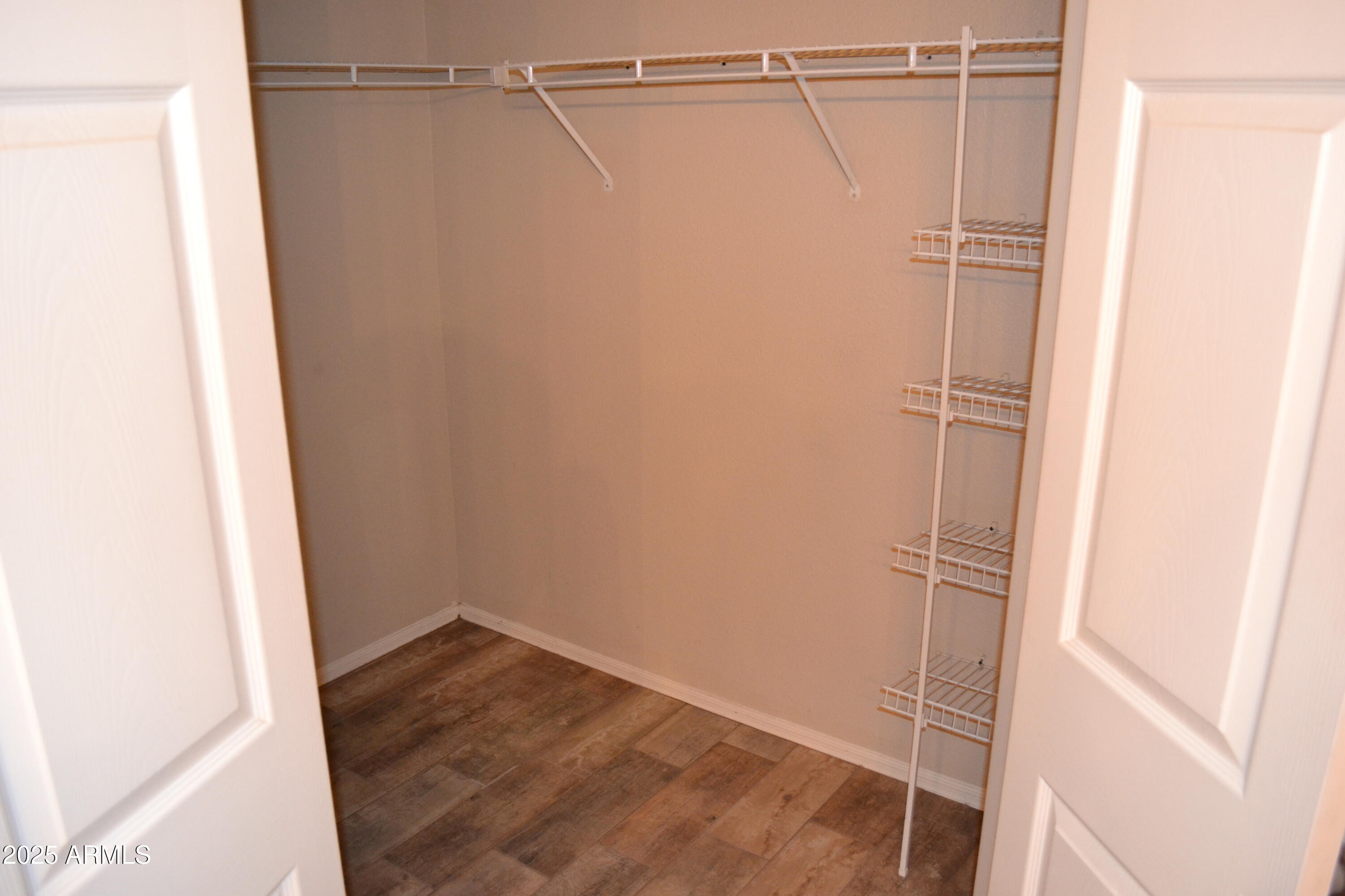 5401 East Van Buren Street, Unit 1011 Phoenix, AZ 85008 - Photo 7 of 17 a view of an empty walk in closet