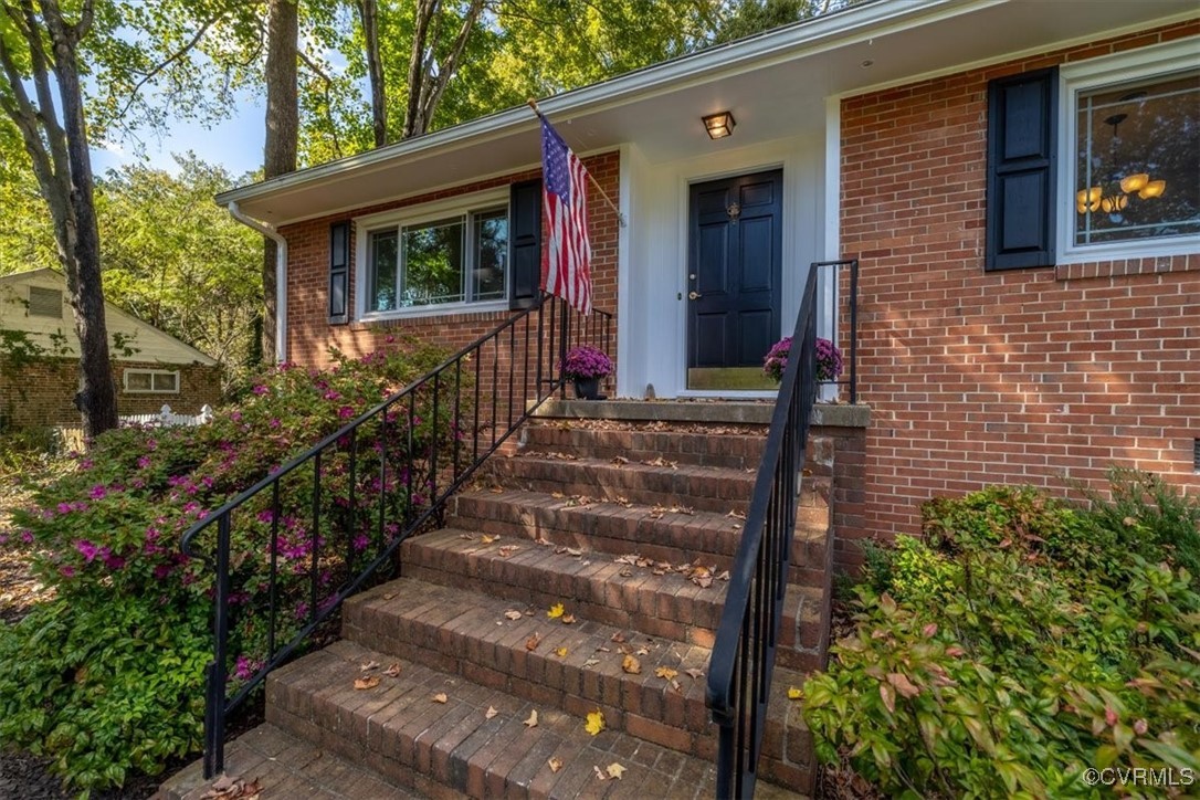 7730 Prairie Road Richmond, VA 23225 - Photo 6 of 50 a view of a house with chairs and wooden fence