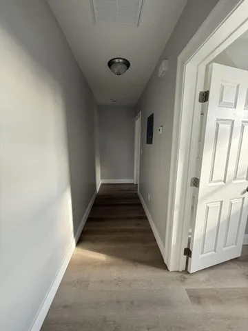 a view of a hallway with staircase