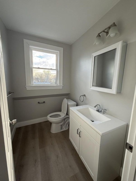 72 Belmont Street, Unit 3 REAR Fall River, MA 02720 - Photo 6 of 7 a bathroom with a toilet sink and mirror