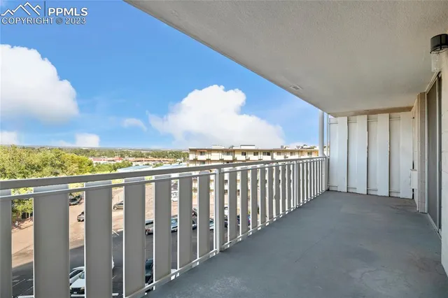 a view of a balcony with city view