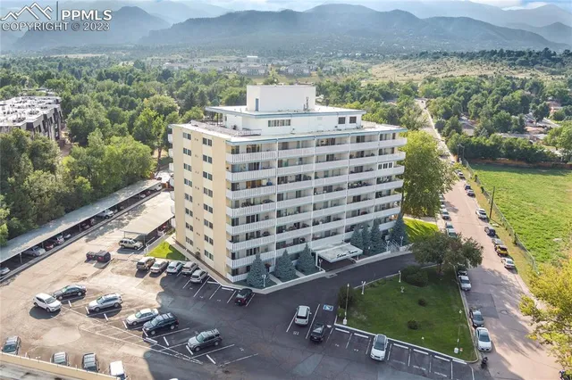 a view of a swimming pool with a yard