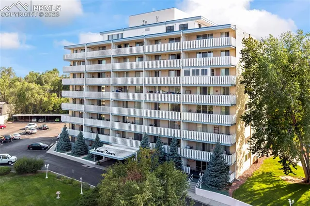 a view of a building with a yard