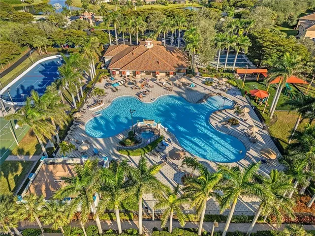 a view of a swimming pool with an outdoor space and seating area