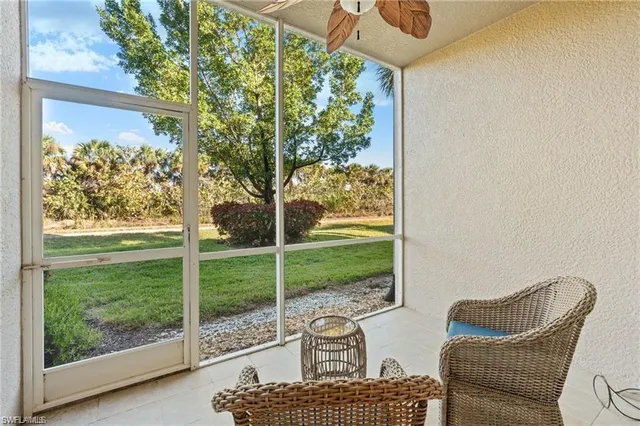 a balcony view with a couch and table
